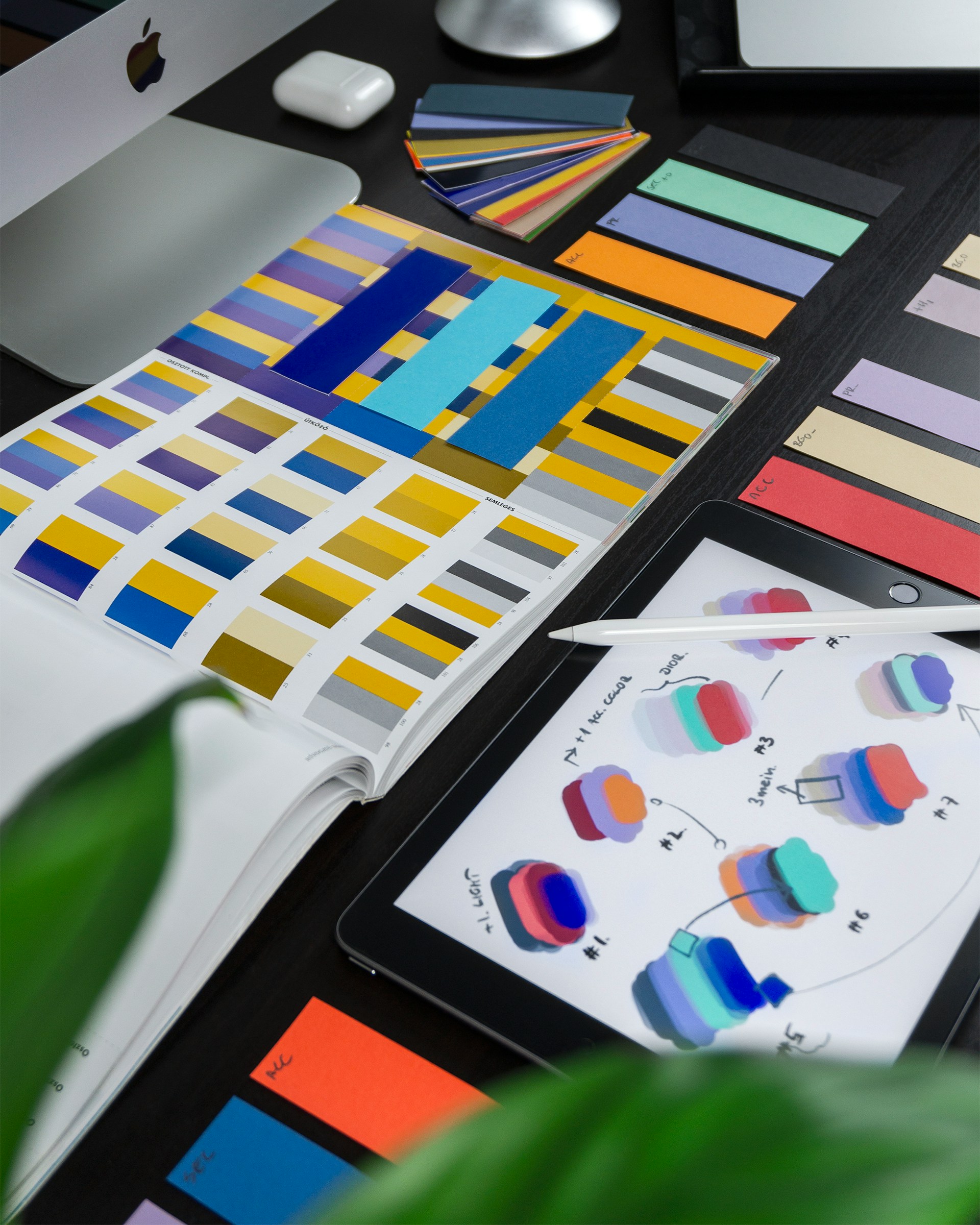 books with colors on them for graphic design and an ipad